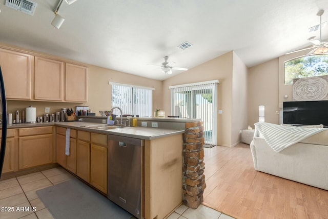 kitchen with visible vents, a ceiling fan, a sink, dishwasher, and a peninsula