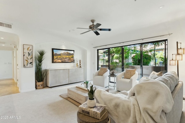 living area featuring visible vents, baseboards, ceiling fan, recessed lighting, and carpet