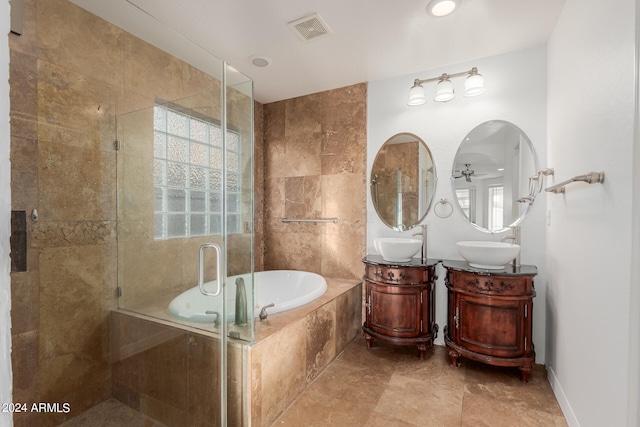 bathroom featuring plus walk in shower, a wealth of natural light, vanity, and ceiling fan