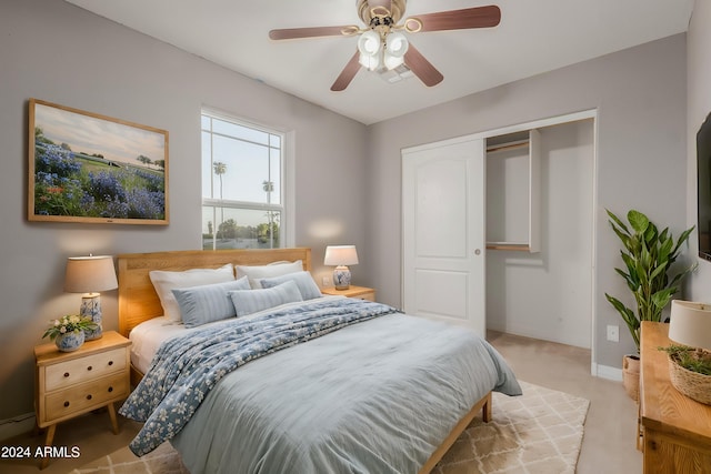 carpeted bedroom with a closet and ceiling fan