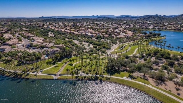 drone / aerial view with a water and mountain view