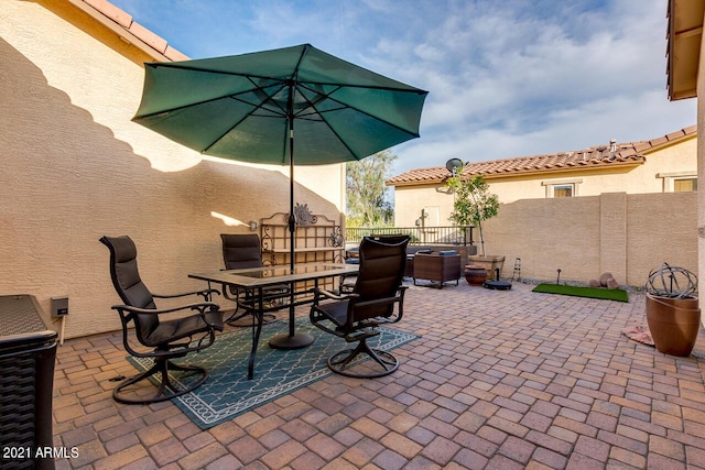 view of patio featuring outdoor dining space and a fenced backyard