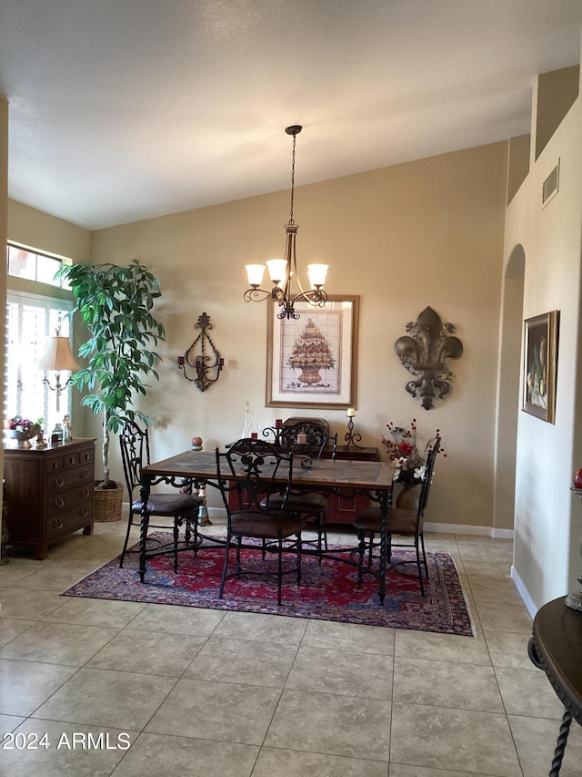 dining space with an inviting chandelier