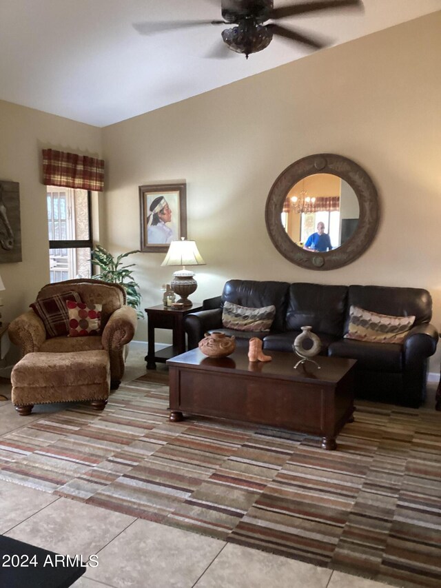 tiled living room with ceiling fan