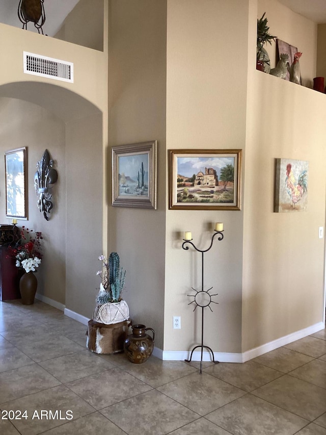 hall featuring tile patterned flooring