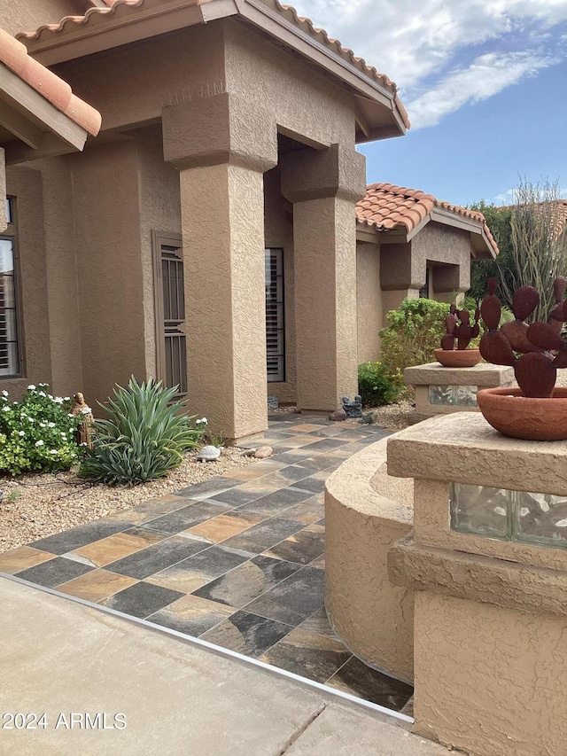 doorway to property with a patio