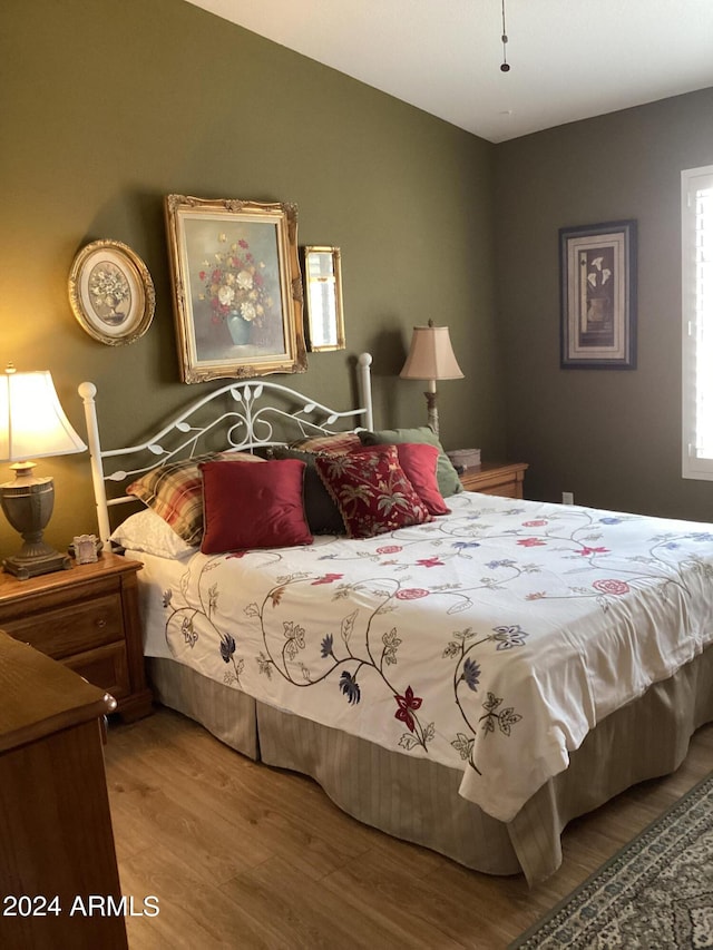 bedroom featuring wood-type flooring