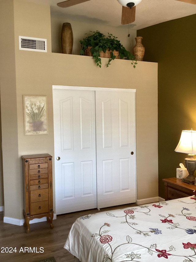 bedroom with a closet, ceiling fan, and hardwood / wood-style floors