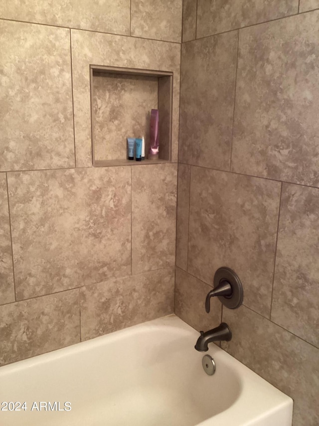 bathroom with a washtub