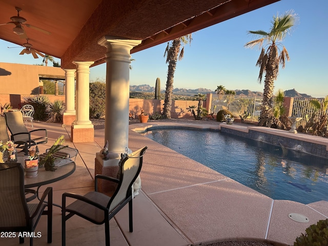 16215 E Carmel Dr, Fountain Hills, AZ 85268 - view of swimming pool with ceiling fan, a fenced backyard, a patio, and a mountain view