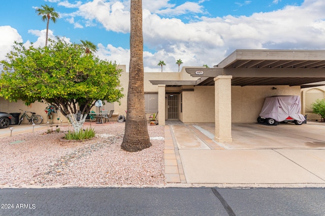 view of front of home with a carport