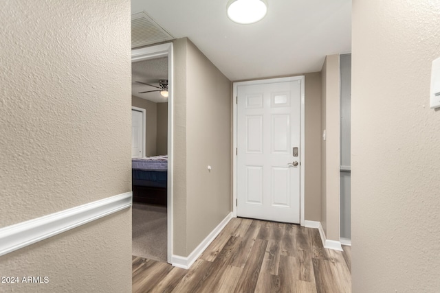 hallway featuring dark wood-type flooring