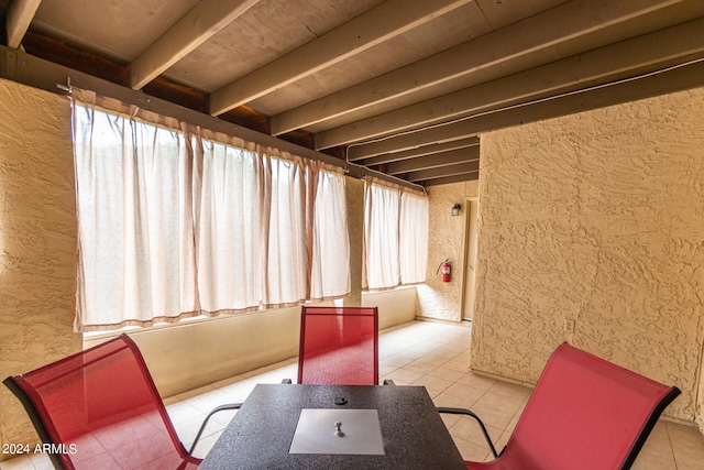 sunroom with beam ceiling