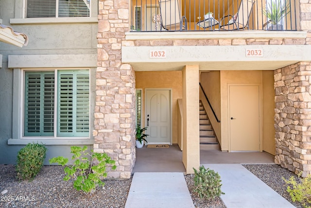 entrance to property featuring a balcony