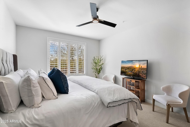 bedroom featuring ceiling fan and light colored carpet