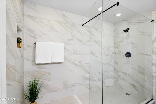 bathroom with a tile shower