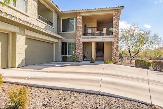 view of front of house with a balcony and a garage