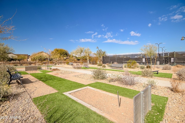 view of home's community with a lawn