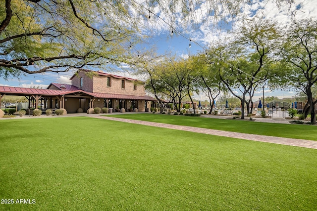 view of home's community with a yard