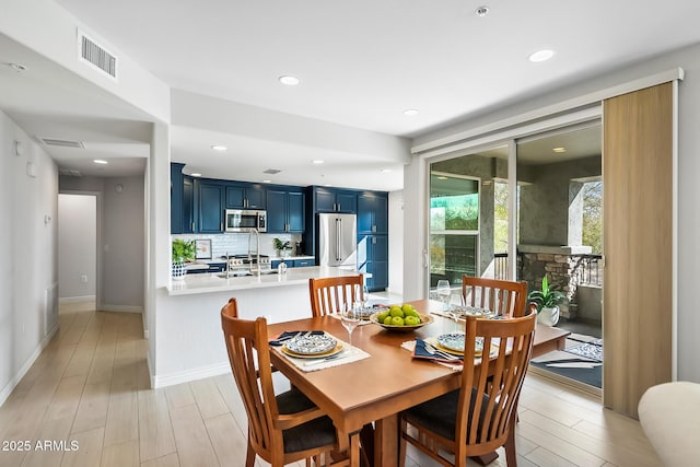 dining room featuring light hardwood / wood-style floors