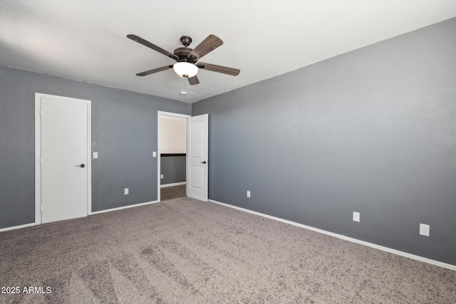 unfurnished bedroom featuring baseboards, a ceiling fan, and carpet