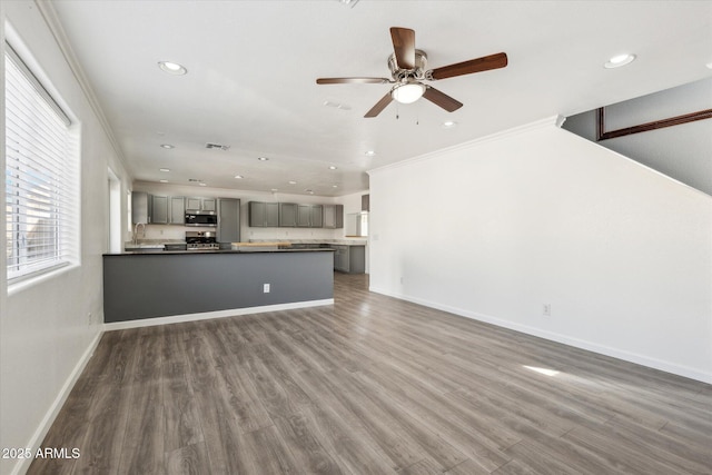 unfurnished living room featuring recessed lighting, visible vents, a ceiling fan, and wood finished floors