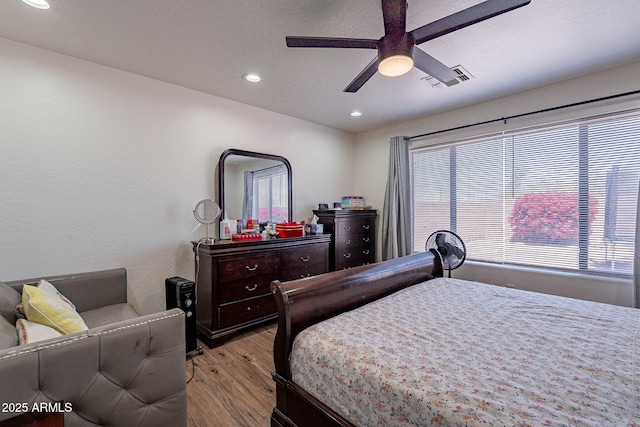2714 E Valencia Dr, Phoenix, AZ 85042 - bedroom with light wood-style floors, recessed lighting, and a ceiling fan