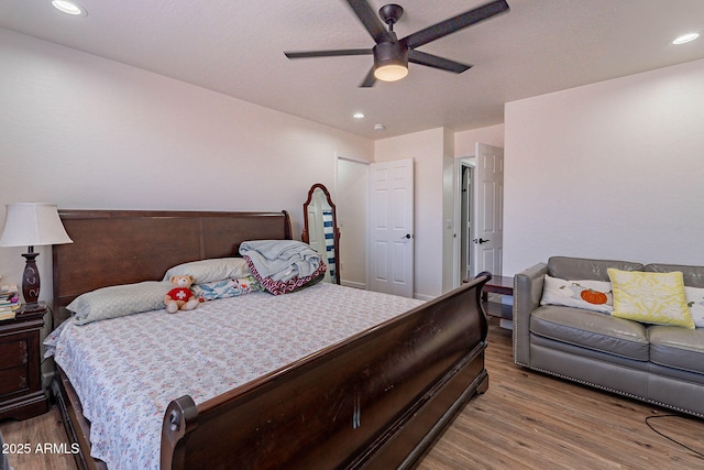 2714 E Valencia Dr, Phoenix, AZ 85042 - bedroom featuring wood finished floors, a ceiling fan, and recessed lighting