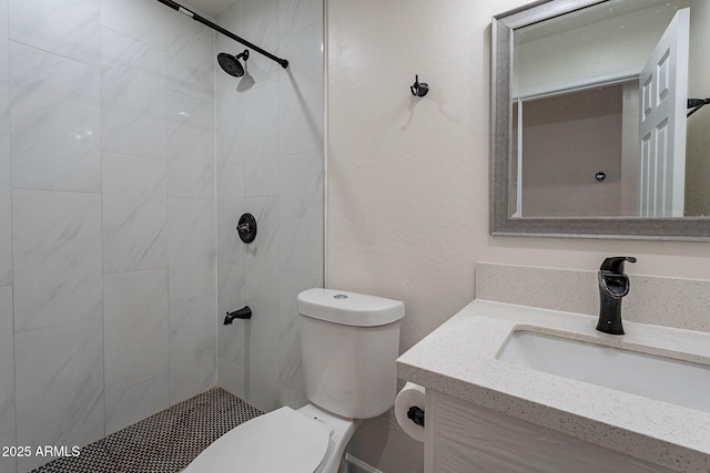 2714 E Valencia Dr, Phoenix, AZ 85042 - bathroom featuring toilet, a tile shower, and vanity