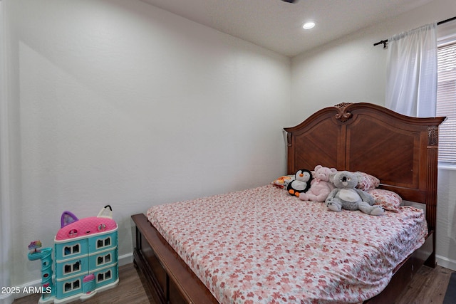 2714 E Valencia Dr, Phoenix, AZ 85042 - bedroom with dark wood-style flooring, baseboards, and recessed lighting