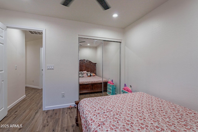 2714 E Valencia Dr, Phoenix, AZ 85042 - bedroom with wood finished floors, baseboards, a closet, and recessed lighting