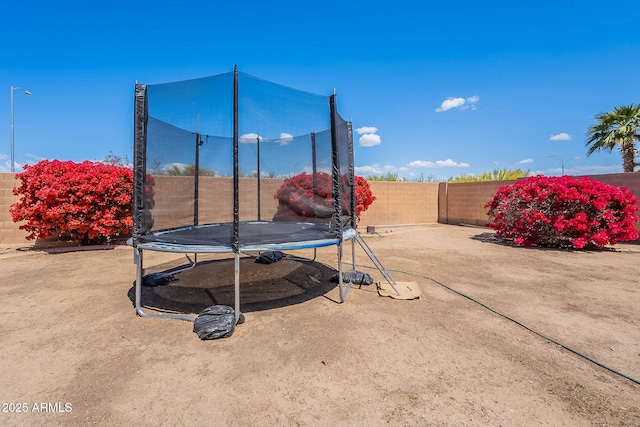 2714 E Valencia Dr, Phoenix, AZ 85042 - fenced backyard featuring a trampoline