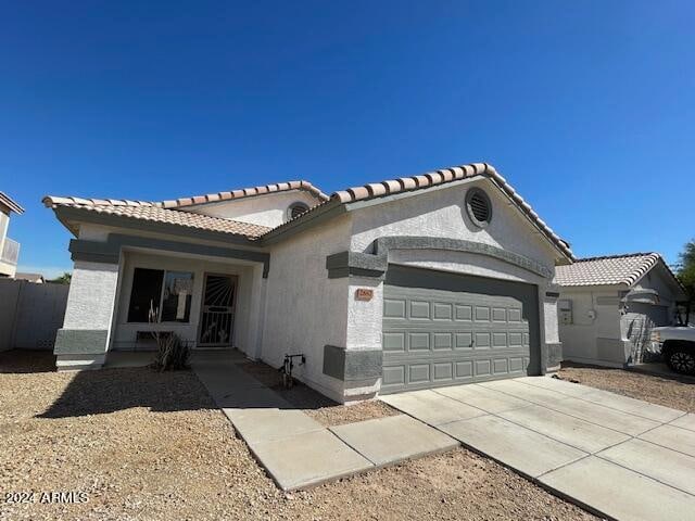 view of front of property with a garage