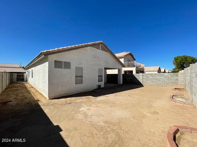 rear view of house with a patio