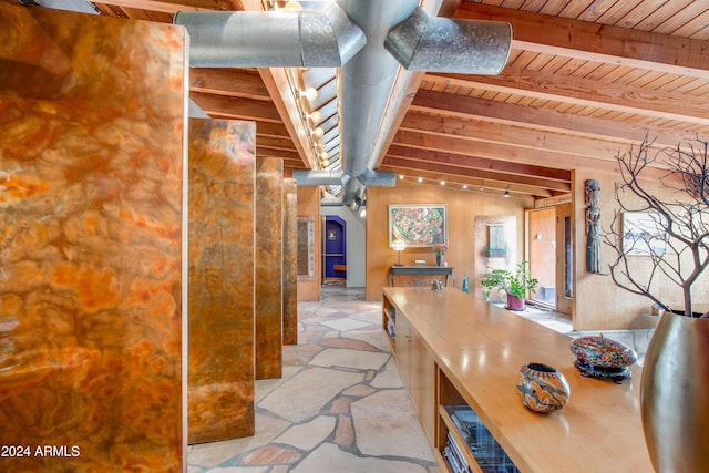 hall featuring vaulted ceiling with beams and wood ceiling