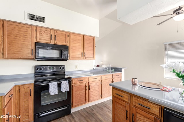 kitchen with light countertops, visible vents, ceiling fan, wood finished floors, and black appliances