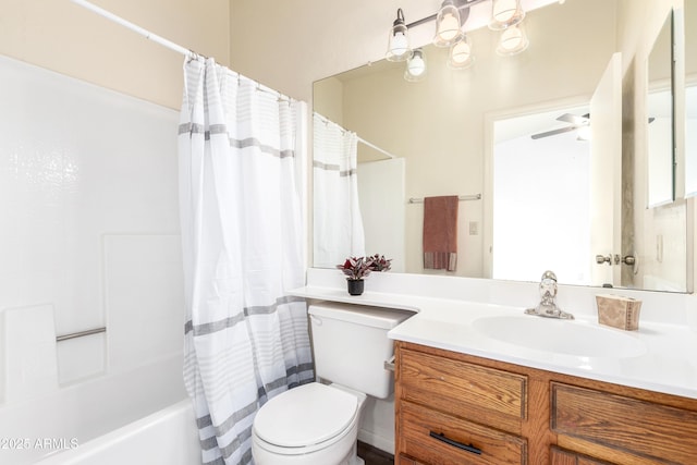 bathroom featuring ceiling fan, vanity, toilet, and shower / bath combo with shower curtain