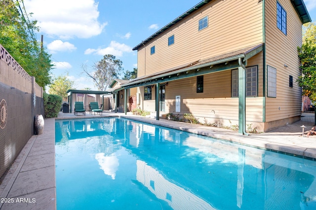 view of swimming pool featuring a patio