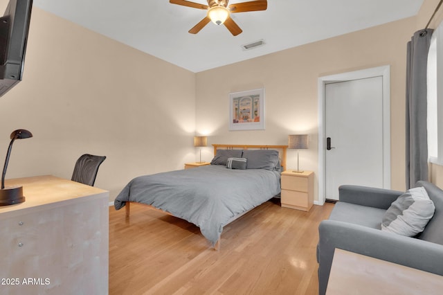 bedroom with ceiling fan and light wood-type flooring