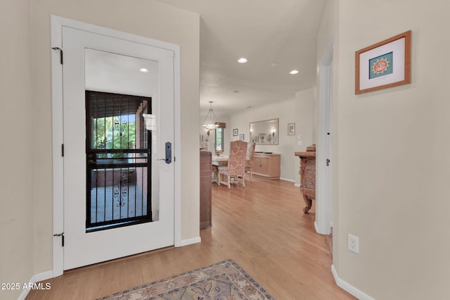 hall with light hardwood / wood-style flooring