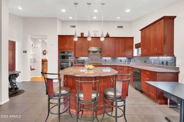 kitchen with pendant lighting, double wall oven, a center island, light tile patterned floors, and light stone countertops