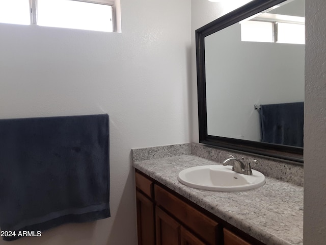 bathroom with vanity and plenty of natural light