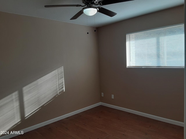 empty room with wood-type flooring and ceiling fan