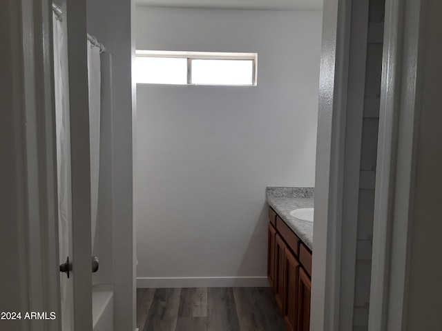 bathroom featuring vanity and hardwood / wood-style floors