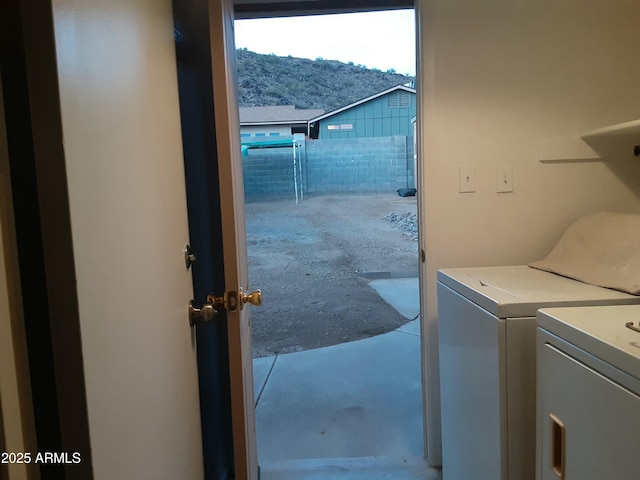 washroom with a mountain view and washing machine and dryer