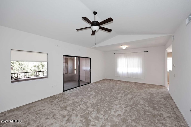 unfurnished bedroom featuring carpet floors, ceiling fan, and lofted ceiling