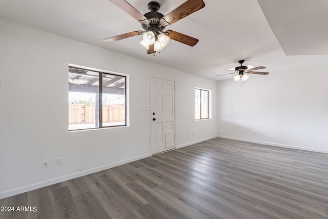 interior space with ceiling fan and dark hardwood / wood-style floors