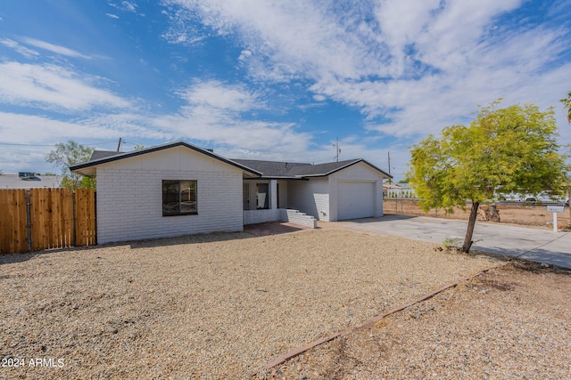 ranch-style house featuring a garage