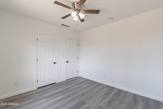 unfurnished bedroom with light hardwood / wood-style flooring and ceiling fan