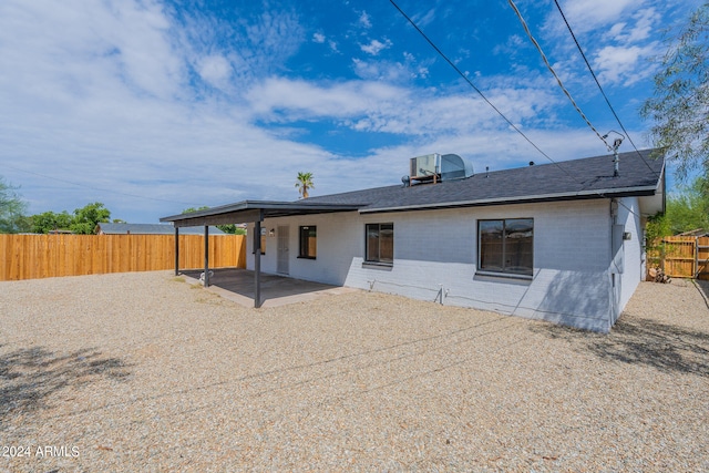 rear view of house featuring a patio area and central AC unit